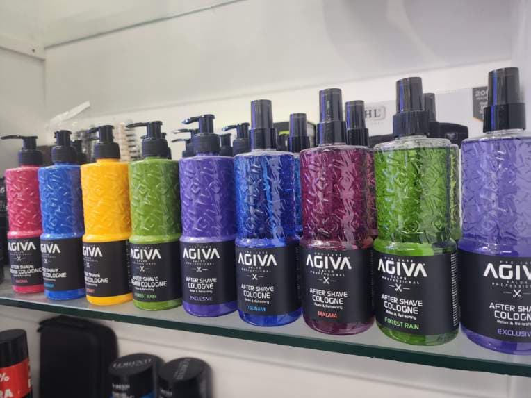 Shelf of Agiva after shave cologne bottles in different colours