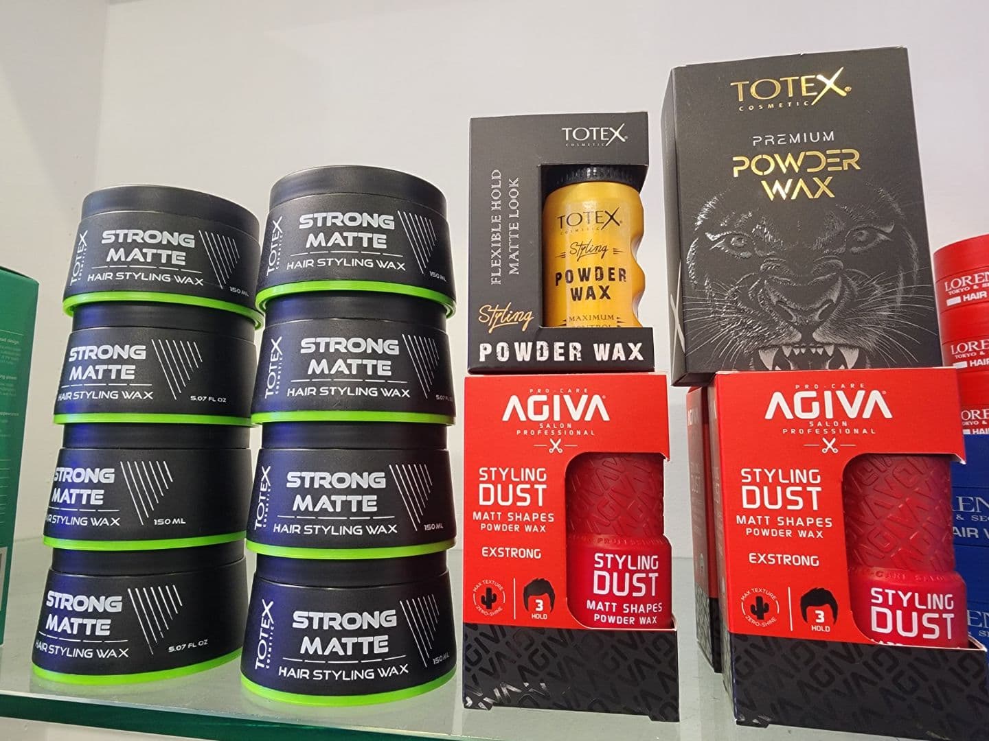 Totex and Agiva hair styling wax and powder wax on a shelf